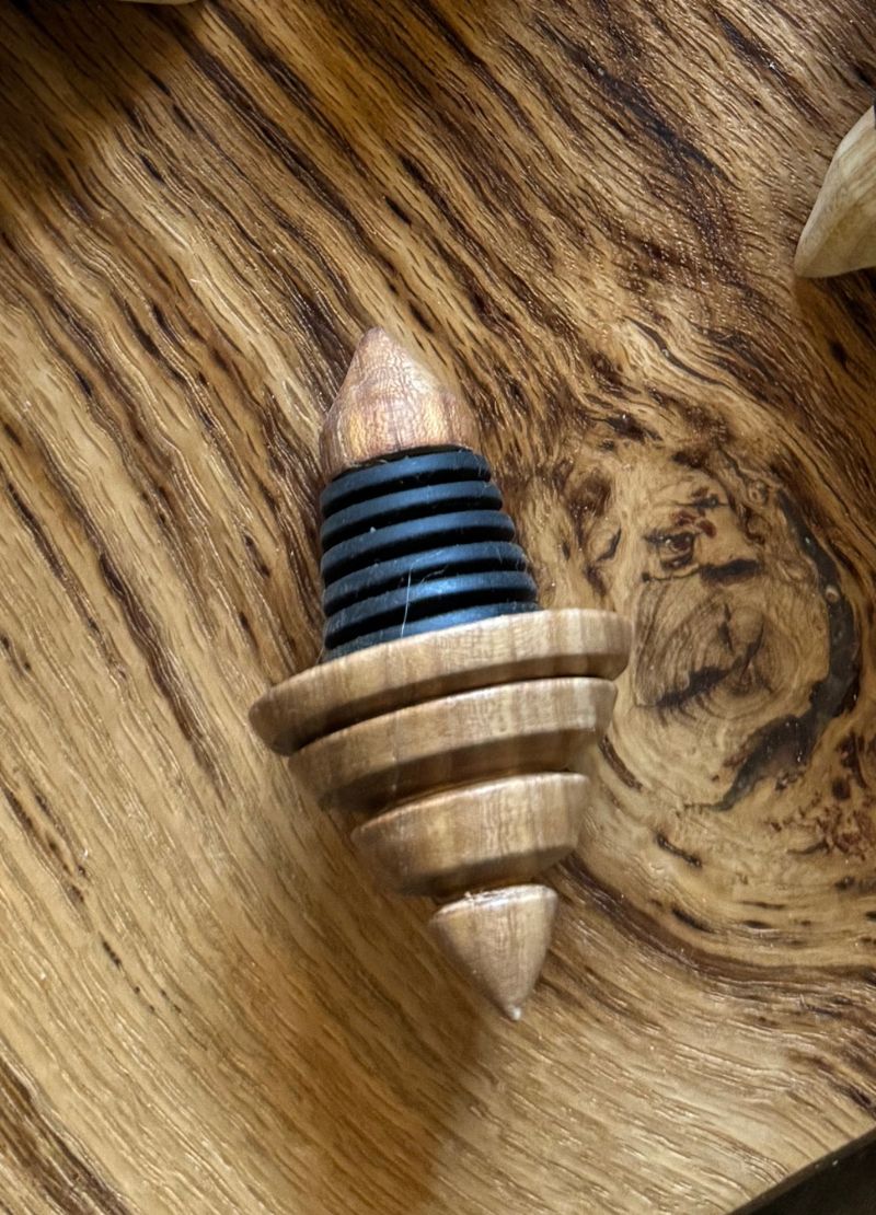 Wooden bottle stopper with black rubber gasket