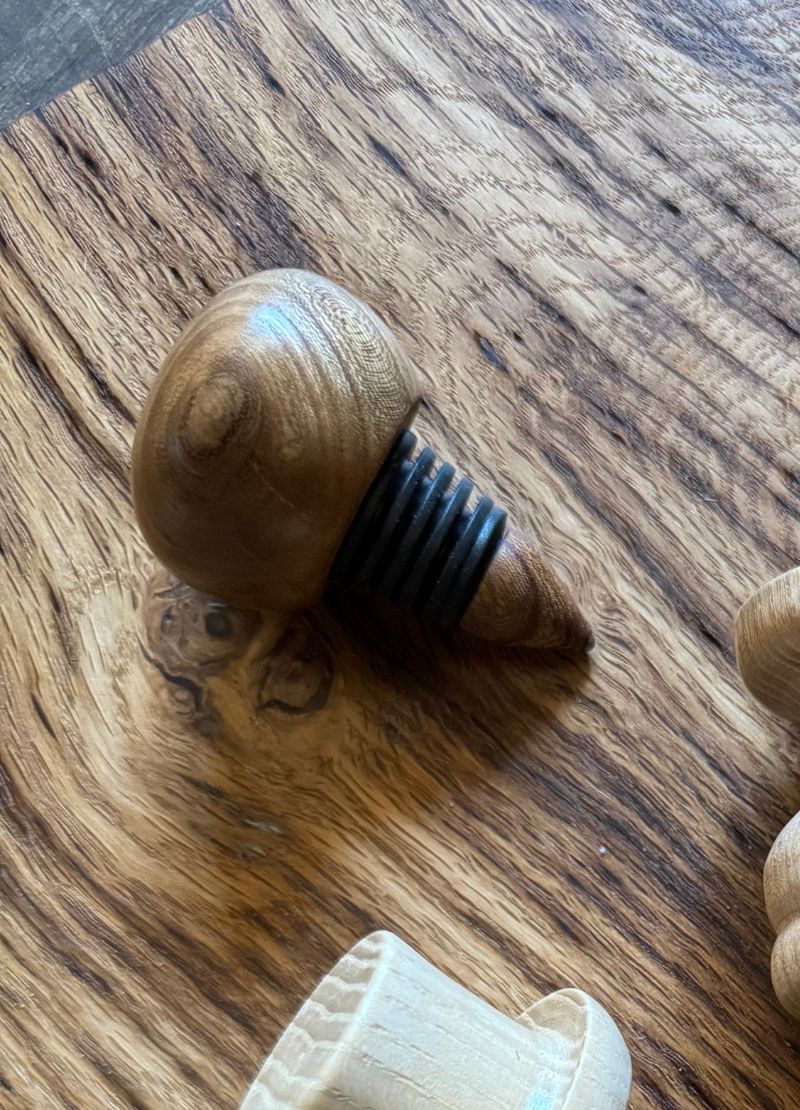 Wooden bottle stopper with black rubber gasket