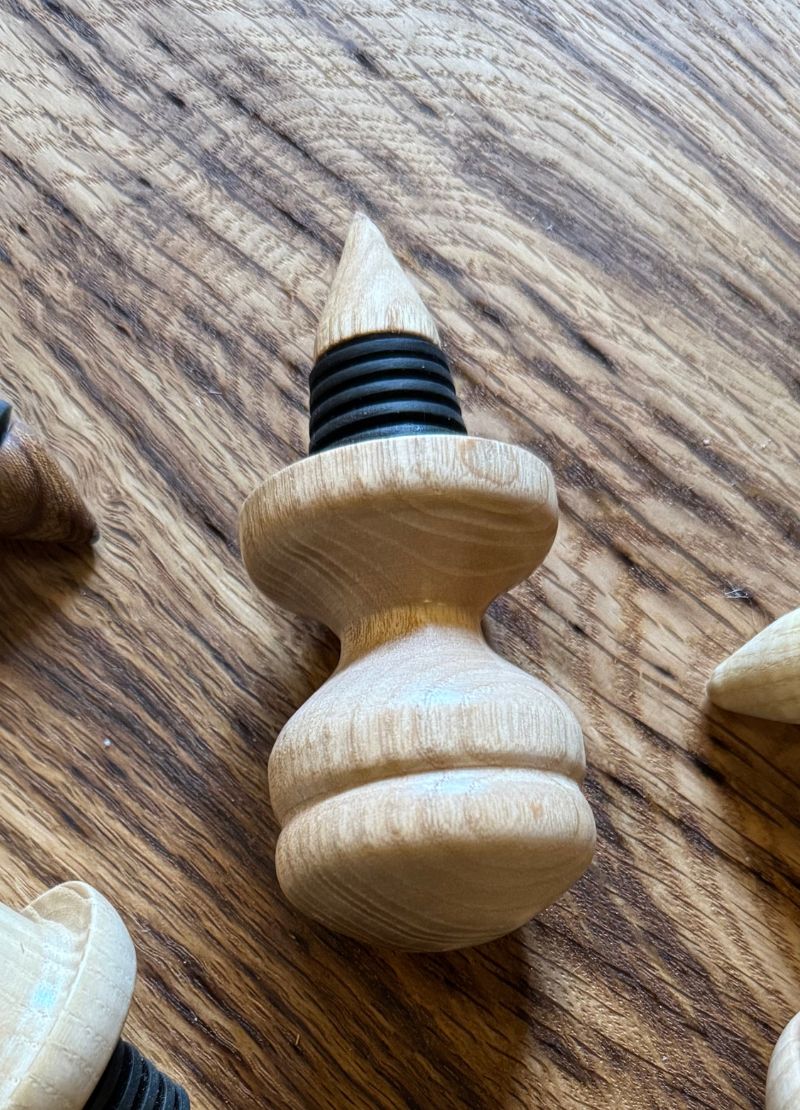 Wooden bottle stopper with black rubber gasket