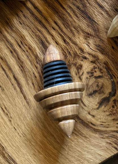 Wooden bottle stopper with black rubber gasket